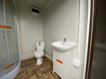 Contenedor sanitario en diseño de madera con depósito de residuos